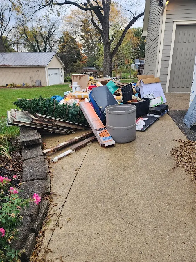 Dumpster being loaded with debris for 3 Yard Dumpster Rental in Mogadore